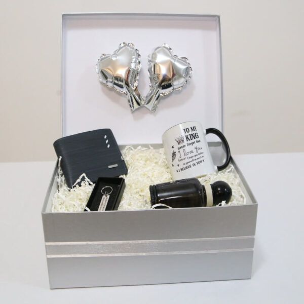 Grey gift box for men with black wallet, perfume, cup, and keychain